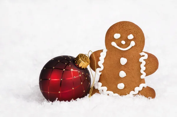Gingerbread man and Christmas ball — Stock Photo, Image