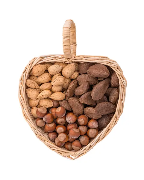 Variety of nuts in heart shape basket — Stock Photo, Image