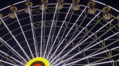 Joyful and Colorful Blurry Amusement Park Fun Fair at Night 
