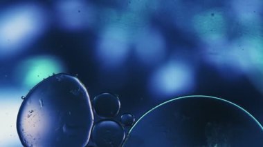 Abstract Colorful Food Oil Circle Drops on Water and Dreamy Air Bubbles 