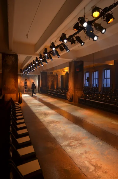 Empty fashion show stage with runway, chairs and lights. — Stock Photo, Image