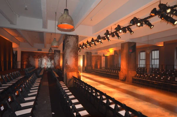 Empty fashion show stage with runway, chairs and lights. — Stock Photo, Image