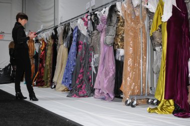 NEW YORK - FEBRUARY 11: Backstage view with dresses before Venexiana Fall Winter 2012 collection show at Lincoln center during New York Fashion Week on February 11, 2012 in NY clipart