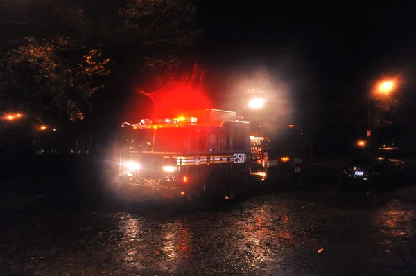 Flooded street with fire track, caused by Hurricane Sandy — Stock Photo, Image