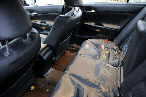 Debris litters inside abondoned car in the Sheapsheadbay neighborhood due to flooding from Hurricane Sandy — Stock Photo, Image