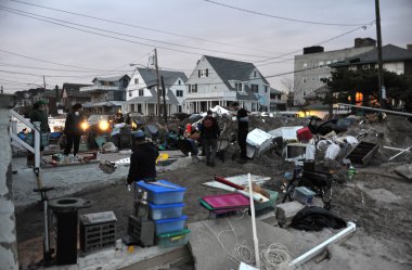 QUEENS, NY - NOVEMBER 11: Deamaged homes and aftermath recovery in the Rockaway area due to impact from Hurricane Sandy in Queens, New York, U.S., on Novemeber 11, 2012. clipart