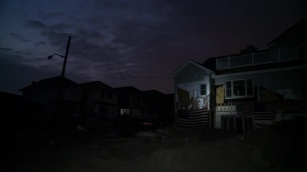 QUEENS, NY - NOVEMBER 11: Damaged houses without power at night in the Rockaway beach - Bel Harbor area due to impact from Hurricane Sandy in Queens, New York, U.S., on November 11, 2012. — Stock Video