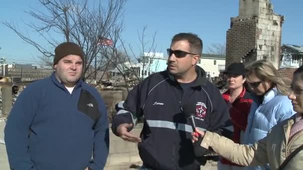 QUEENS, NY - NOVEMBER 11: getting help with hot food, clothes and supplies in the Rockaway beach area after impact from Hurricane Sandy in Queens, New York, U.S., on November 11, 2012. — Stock Video