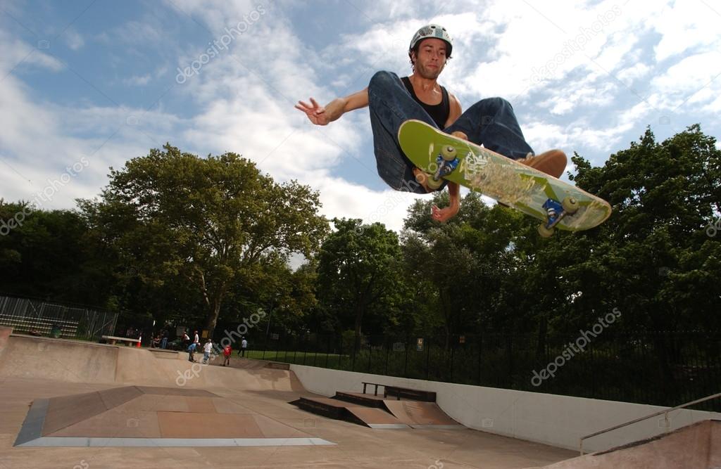 Skateboarder jumping in the halfpipe