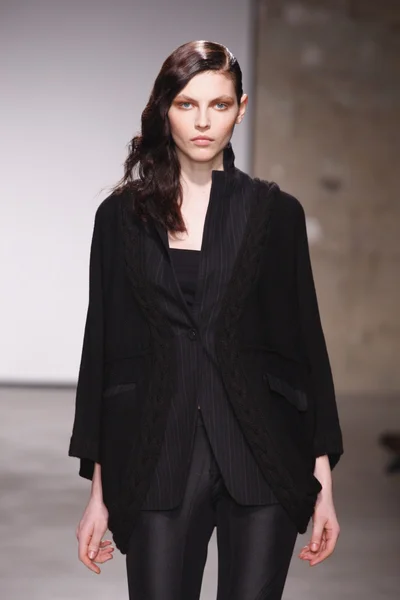 PARIS, FRANCE - FEBRUARY 29: A model walks the runway during the Atsuro Tayama Ready to Wear Fall Winter 2011 show as part of the Paris Fashion Week on February 29, 2012 in Paris, France — Stock Photo, Image