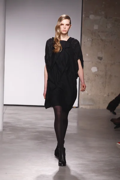 PARIS, FRANCE - FEBRUARY 29: A model walks the runway during the Atsuro Tayama Ready to Wear Fall Winter 2011 show as part of the Paris Fashion Week on February 29, 2012 in Paris, France — Stock Photo, Image