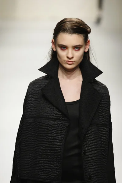 PARIS, FRANCE - MARCH 07: A model walks the runway during the Comuun Ready to Wear Autumn Winter 2011 2012 show during Paris Fashion Week on March 7, 2011 in Paris, France — Stock Photo, Image