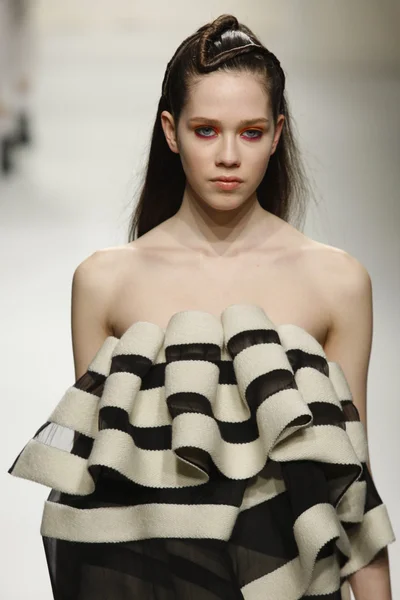 PARIS, FRANCE - MARCH 07: A model walks the runway during the Comuun Ready to Wear Autumn Winter 2011 2012 show during Paris Fashion Week on March 7, 2011 in Paris, France — Stock Photo, Image