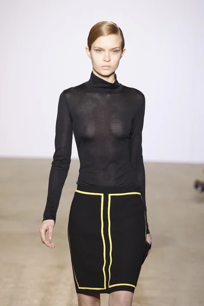 PARIS, FRANCE - MARCH 06: A model walks the runway at the Costume National fashion show during Paris Fashion Week on March 6, 2011 in Paris, France — Stock Photo, Image