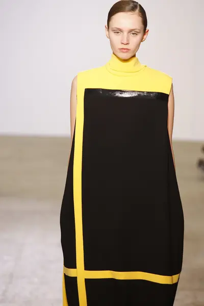 PARIS, FRANCE - MARCH 06: A model walks the runway at the Costume National fashion show during Paris Fashion Week on March 6, 2011 in Paris, France — Stock Photo, Image