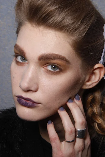 PARIS, FRANCE - MARCH 06: A model gets ready backstage at the Kenzo fashion show during Paris Fashion Week on March 6, 2011 in Paris, France. — Stock Photo, Image