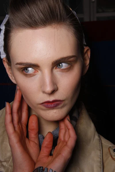 PARIS, FRANCE - MARCH 06: A model gets ready backstage at the Kenzo fashion show during Paris Fashion Week on March 6, 2011 in Paris, France. — Stock Photo, Image