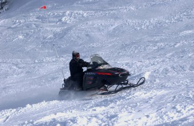 Snowmobiling the Mountains from summit of Alta ski resort in Utah