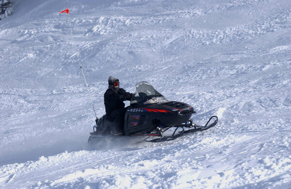 Snowmobiling the Mountains from summit of Alta ski resort in Utah
