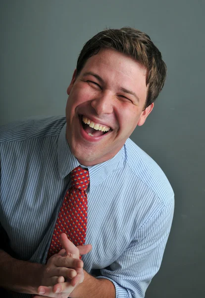 Young male actor making emotional facial expression in front of camera — Stock Photo, Image