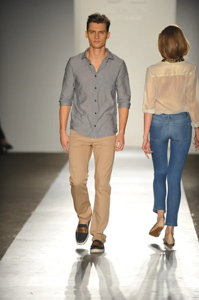 A model walks the runway at the DL 1961 Premium Denim spring 2013 fashion show Stock Picture