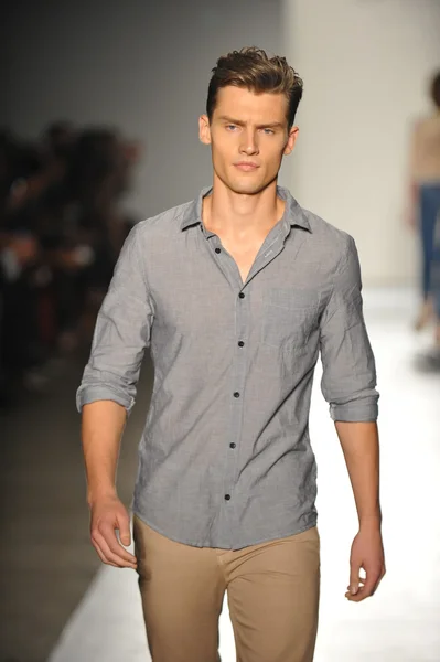 A model walks the runway at the DL 1961 Premium Denim spring 2013 fashion show Stock Image