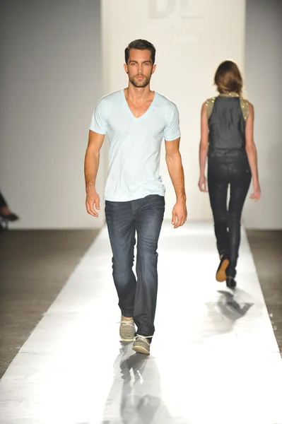 A model walks the runway at the DL 1961 Premium Denim spring 2013 fashion show Stock Picture