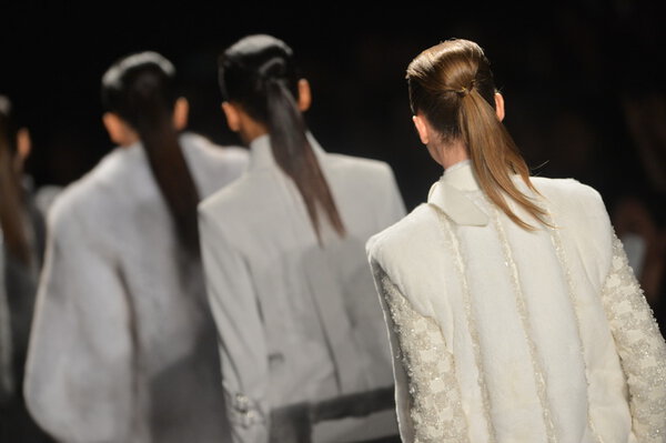 NEW YORK - FEBRUARY 08: A models walk the runway at the Academy of Art University Fall Winter 2013 Fashion Show during Mercedes-Benz Fashion Week on February 8, 2013 in New York City