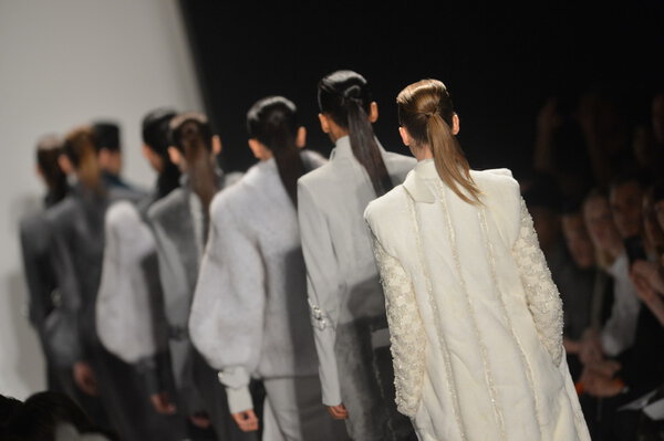 NEW YORK - FEBRUARY 08: A models walk the runway at the Academy of Art University Fall Winter 2013 Fashion Show during Mercedes-Benz Fashion Week on February 8, 2013 in New York City