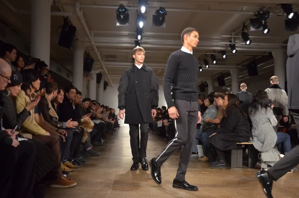 NEW YORK, NY - FEBRUARY 11: Models walk the runway during the Tim Coppens fall 2013 presentation during MADE Fashion Week at Milk Studios on February 11, 2013 in New York City. — Stock Photo, Image