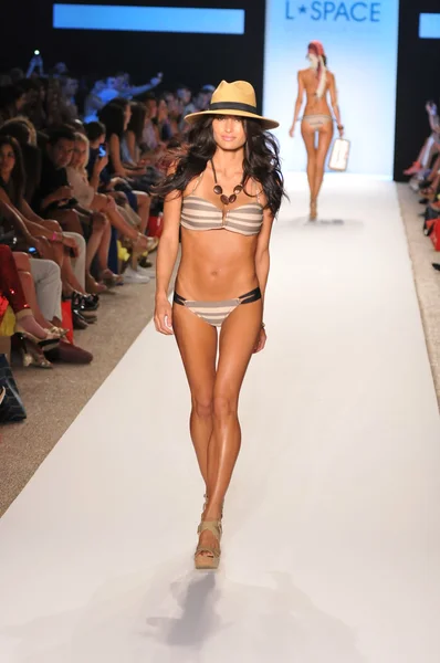 MIAMI - JULY 15: Model walks runway at the L Space Swimsuit Collection for Spring, Summer 2012 during Mercedes-Benz Swim Fashion Week on July 15, 2011 in Miami