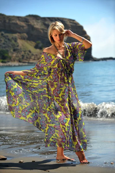 Pretty model posing in colourful dress — Stock Photo, Image