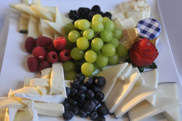 Different tasty snacks and cheese for wine — Stock Photo, Image