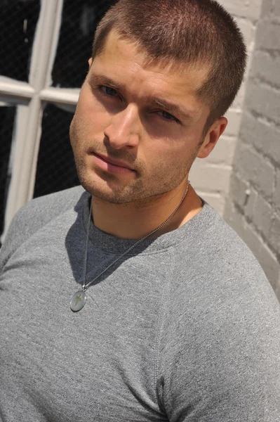 Male actor head shot showing action movie character — Stock Photo, Image