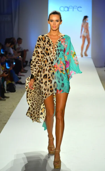 A model walks the runway at the Caffe Swimwear show — Stock Photo, Image