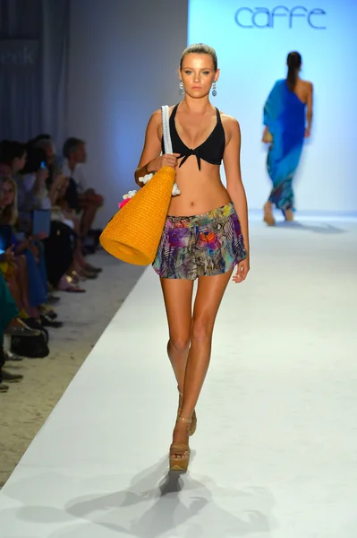 A model walks the runway at the Caffe Swimwear show — Stock Photo, Image