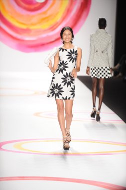 A model walks the runway at the Desigual Spring 2014 fashion show