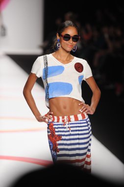 A model walks the runway at the Desigual Spring 2014 fashion show