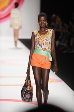 A model walks the runway at the Desigual Spring 2014 fashion show