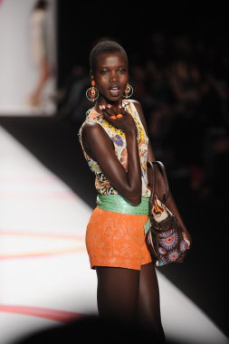 A model walks the runway at the Desigual Spring 2014 fashion show
