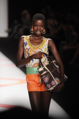 A model walks the runway at the Desigual Spring 2014 fashion show