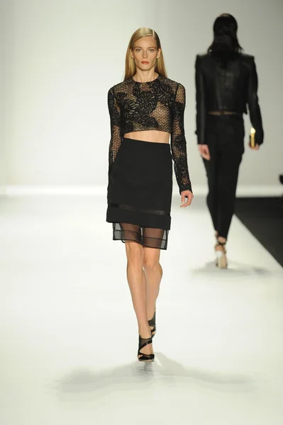 Model walks runway at J. Mendel show Stock Image