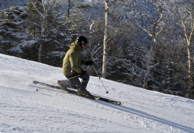 Telemarker skiing on ski slopes clipart