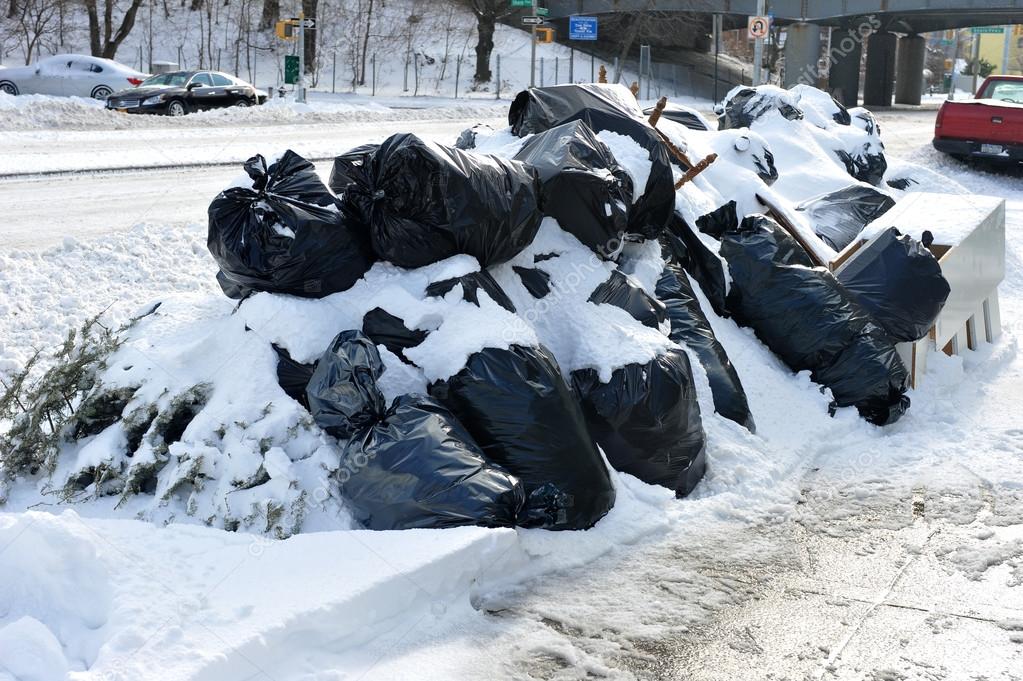 Garbage bags under fresh snow in NYC