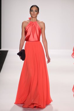 Model walks runway wearing Giada Curti
