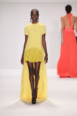 Model walks runway wearing Giada Curti