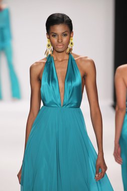 Model walks runway wearing Giada Curti