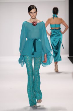 Model walks runway wearing Giada Curti