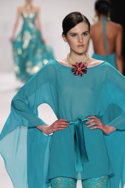 Model walks runway wearing Giada Curti