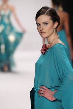 Model walks runway wearing Giada Curti